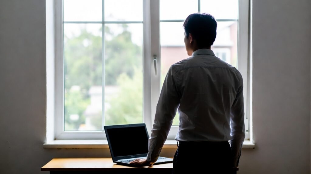 Person practicing mindful technology habits at laptop